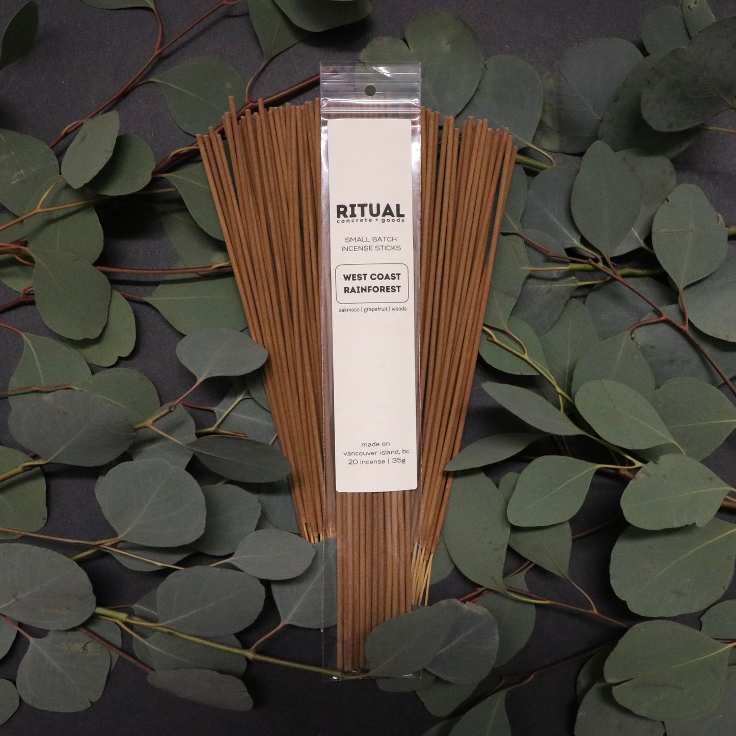 west coast rainforest incense sticks on black background with leaves
